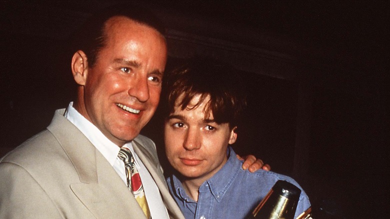 Phil Hartman and Mike Myers, posing and smiling together