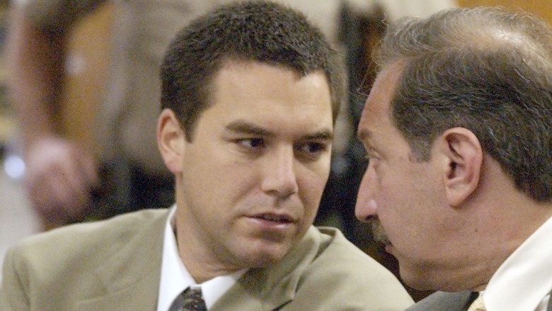 Scott Peterson talking to his lawyer in court