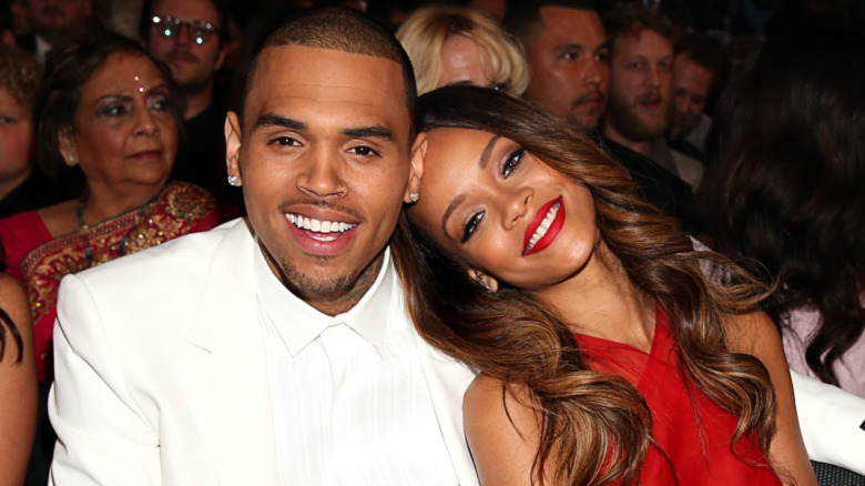 Rihanna leaning on Chris Brown's shoulder 