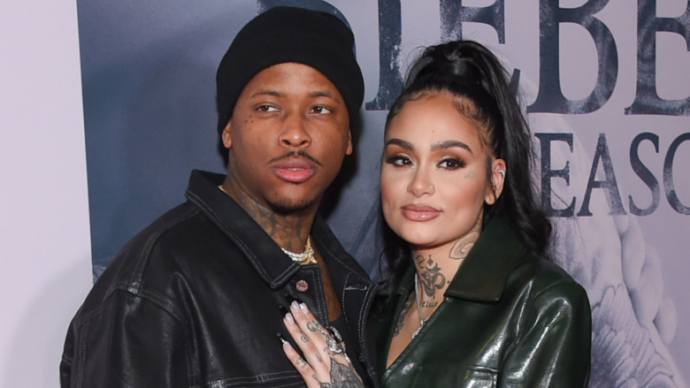 YG and Kehlani both posing and wearing black