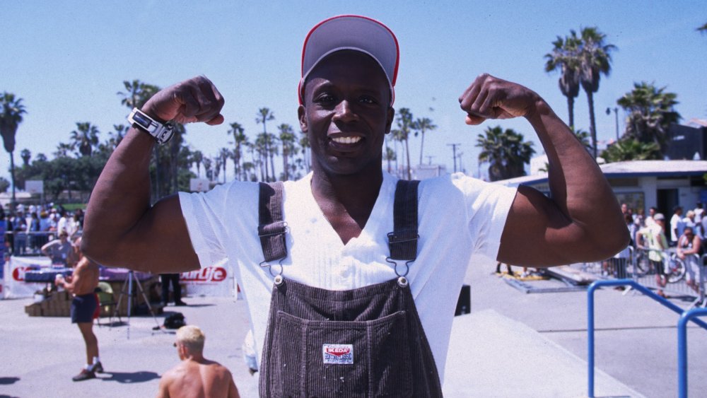 Billy Blanks flexing his biceps