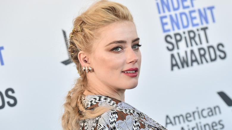 Amber Heard smirking 