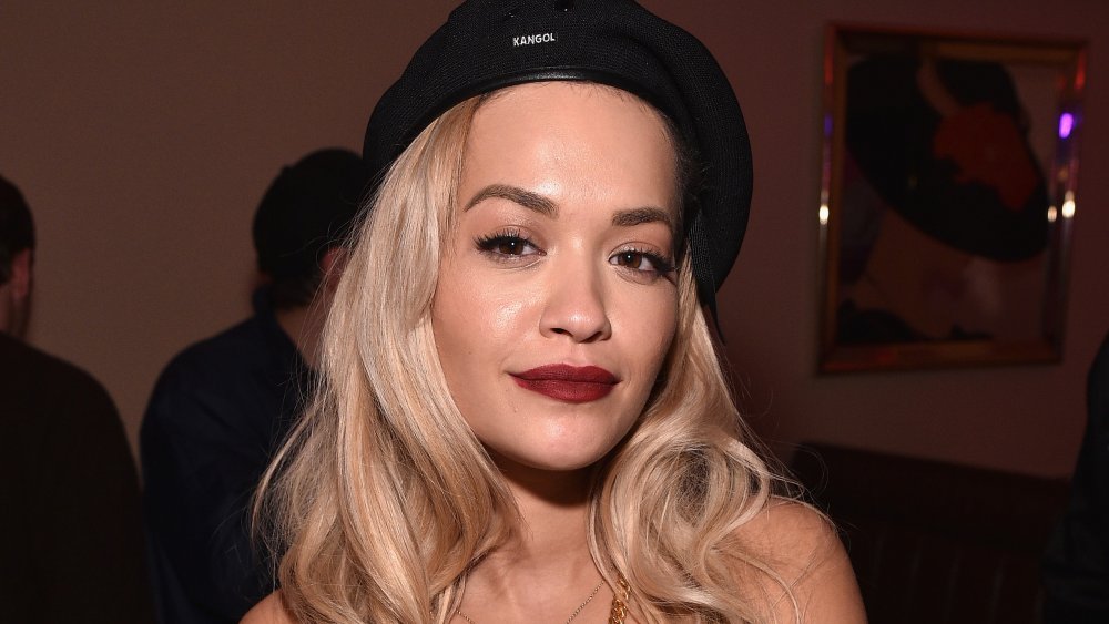 Rita Ora in a black beret and red lipstick 