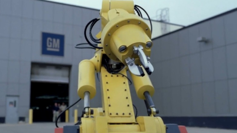 Yellow robot leaving GM building