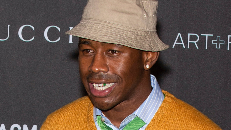 Tyler, the Creator smiling bucket hat