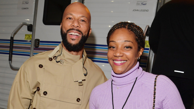 Common and Tiffany Haddish smiling 