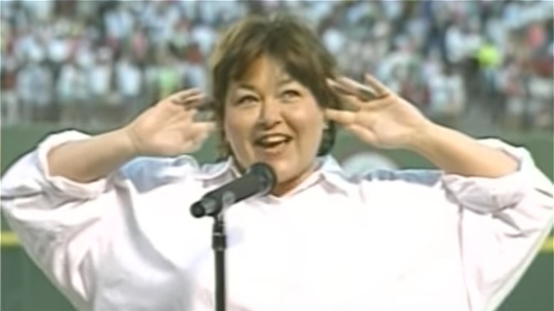 Roseanne Barr with her fingers in her ears