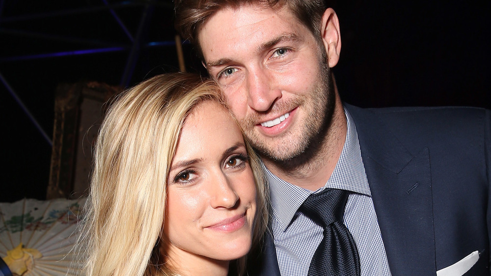 Kristin Cavallari and Jay Cutler with their faces pressed together 