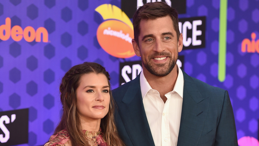 Danica Patrick and Aaron Rodgers smiling 