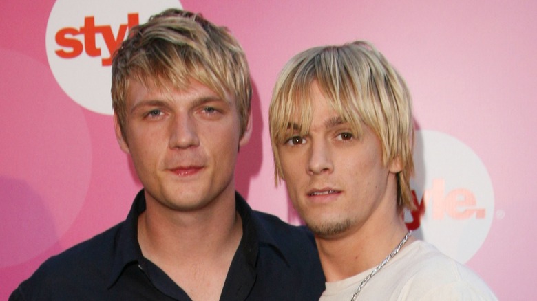 Nick Carter and Aaron Carter both looking at camera