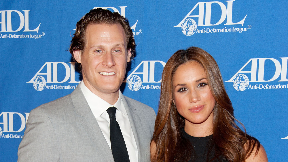 Meghan Markle and ex-husband Trevor Engelson smiling 