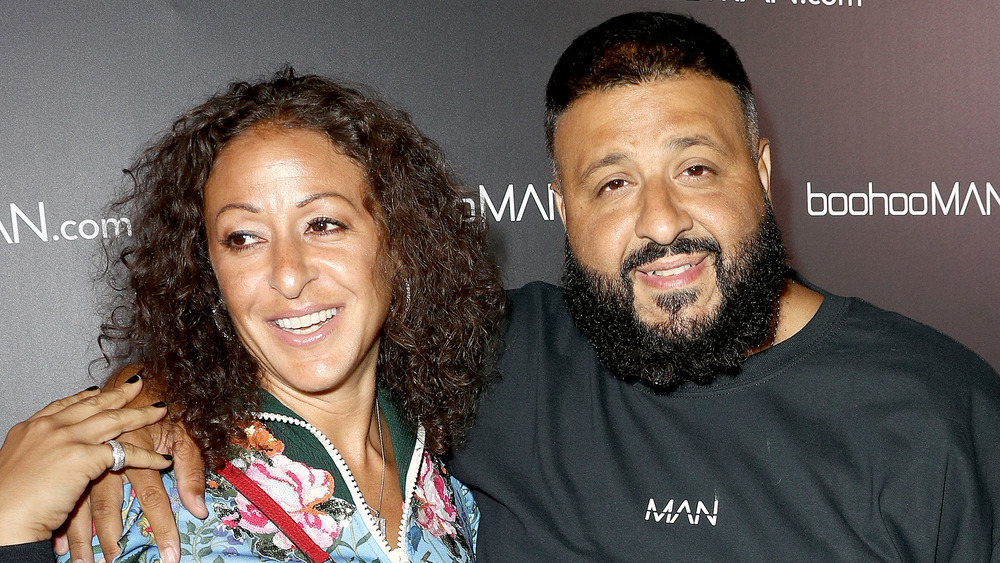 Nicole Tuck and DJ Khaled posing arm in arm and smiling