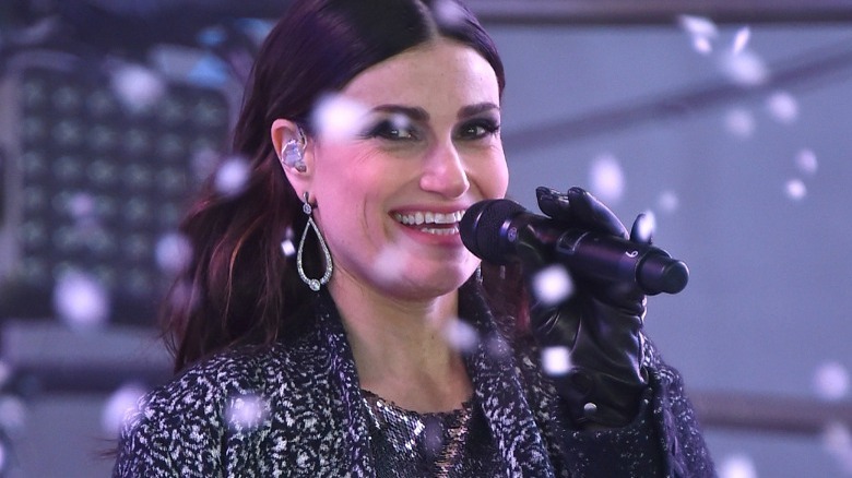 Idina Menzel singing while surrounded by snow