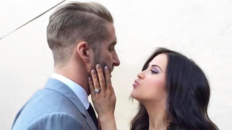 Shawn Booth and Kaitlyn Bristowe embracing
