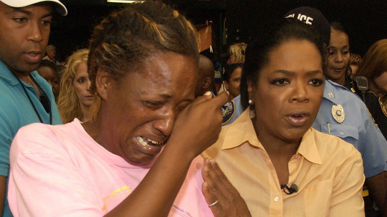 Oprah Winfrey comforting Katrina survivor