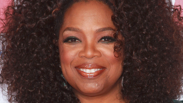 Oprah Winfrey smiling in green top