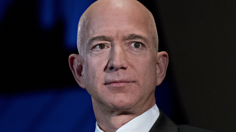 Jeff Bezos looks on