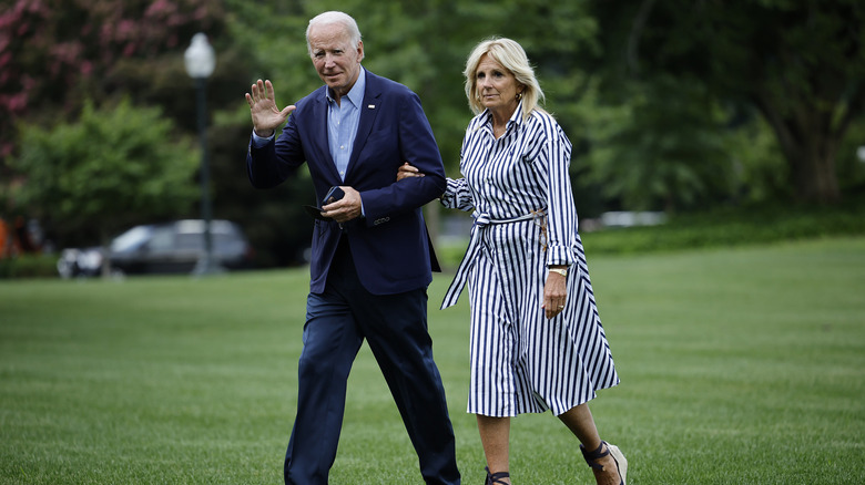 President Joe Biden and first lady Jill Biden walking across the South Lawn as they return to the White House from Rehoboth Beach