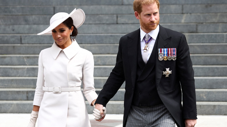 Meghan Markle and Prince Harry holding hands