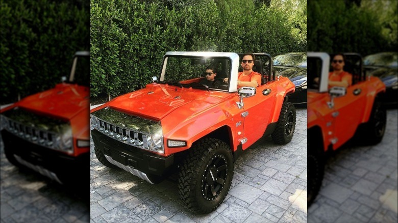 Scott Disick in a mini Hummer