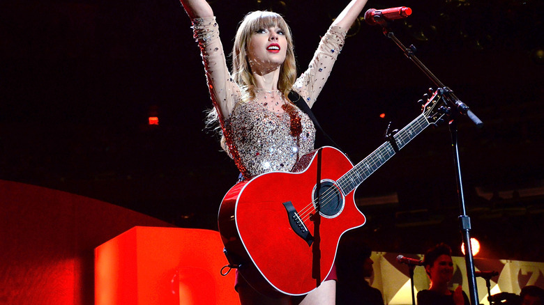 Taylor Swift performing with guitar