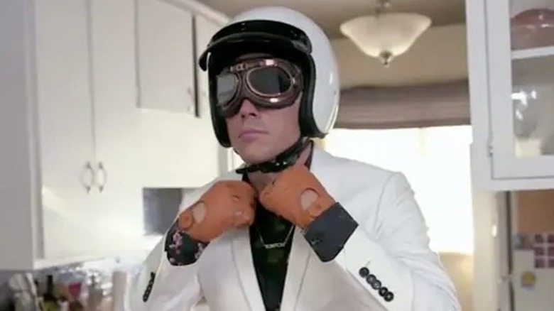 Tom Sandoval in white suit and motorcycle gear