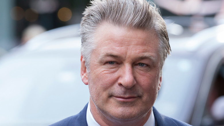 Alec Baldwin clean cut and small smile