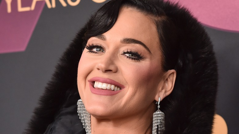 Katy Perry smiling in fur