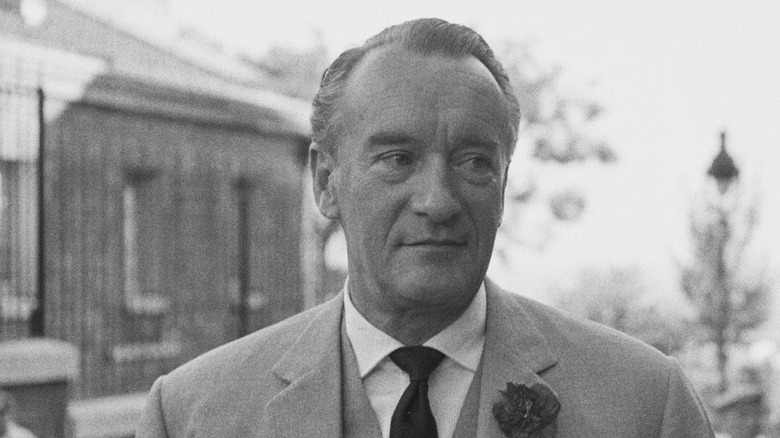 George Sanders wearing a suit