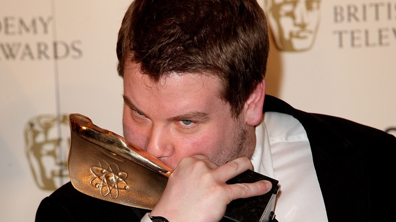 James Corden kissing his BAFTA award