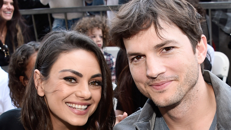 Mila Kunis and Ashton Kutcher at an event