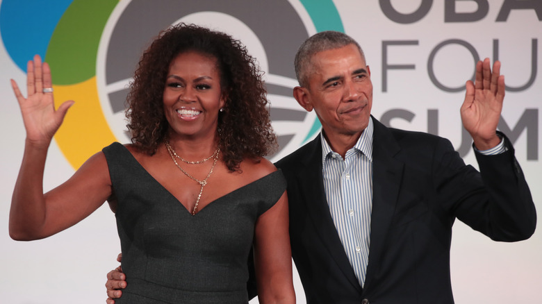 Barack and Michelle Obama waving