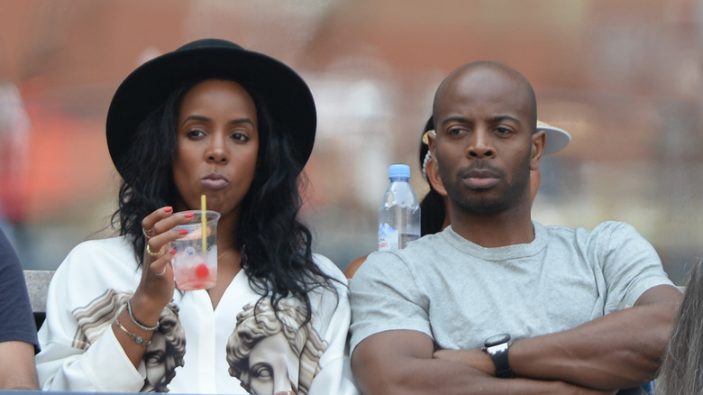 Kelly Rowland and Tim Weatherspoon seated