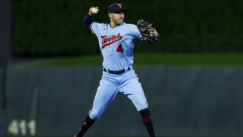 Carlos Correa throwing a baseball