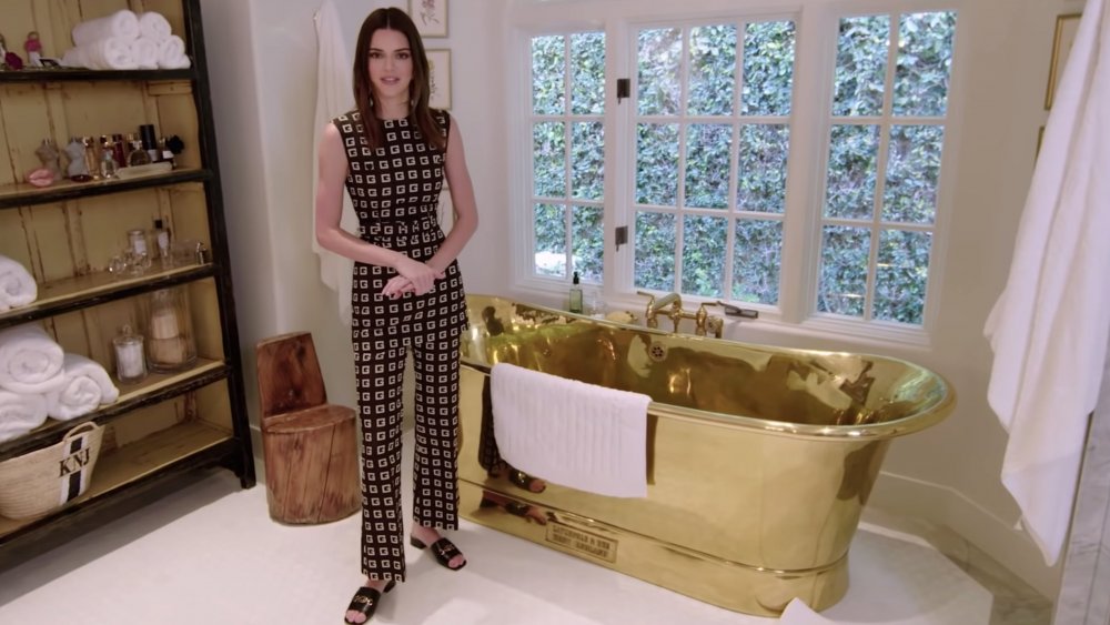 Kendall Jenner next to gold bathtub