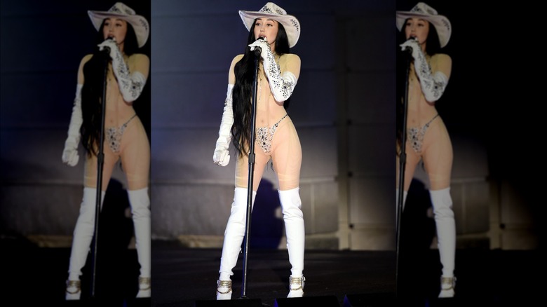 Noah Cyrus performing at the 2020 CMT Awards in a rhinestone-embellished body stocking