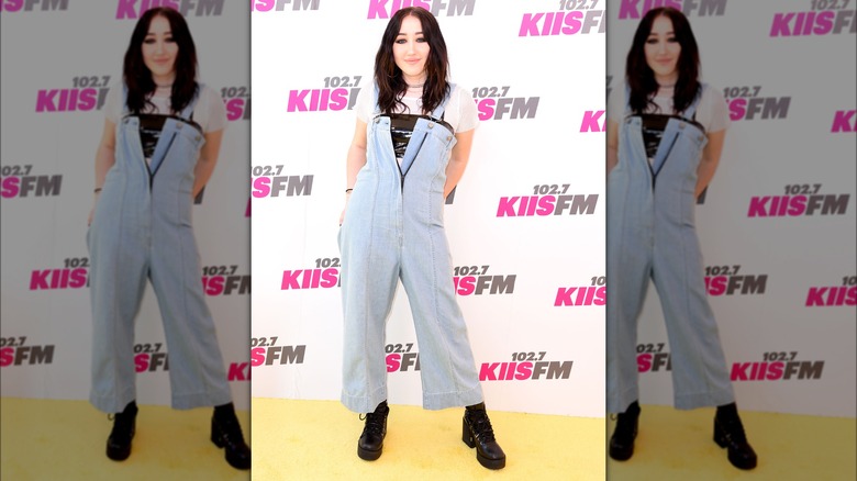 Noah Cyrus wearing overalls with a front zipper at Wango Tango