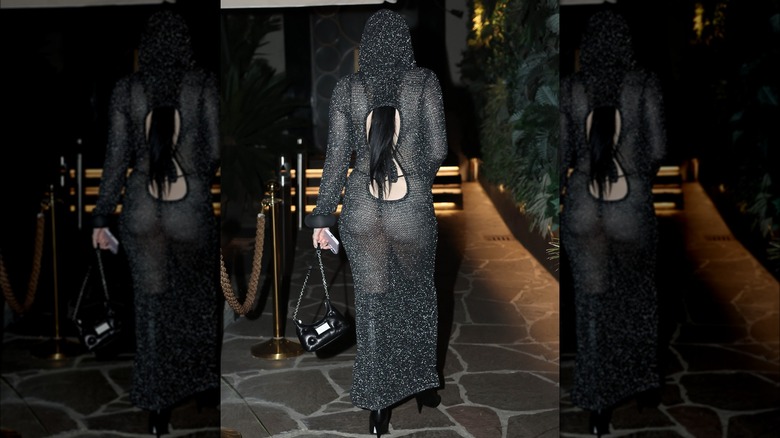 Noah Cyrus wearing a see-through black dress with a hood at Milan Fashion Week