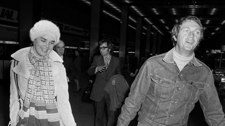 Ali MacGraw and Steve McQueen walking