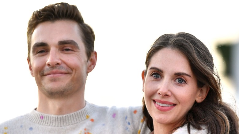 Dave Franco with his arm around Alison Brie