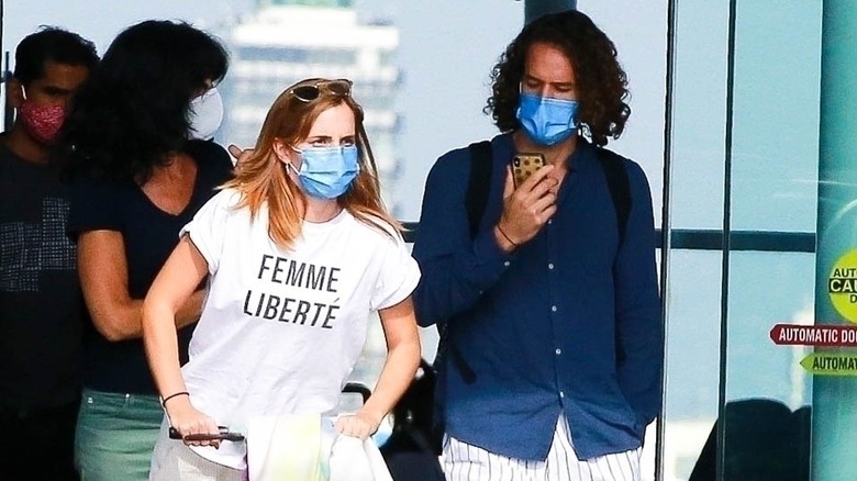 Emma Watson and Leo Robinton at an airport