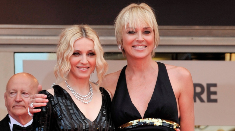 Madonna and Sharon Stone embracing on the red carpet