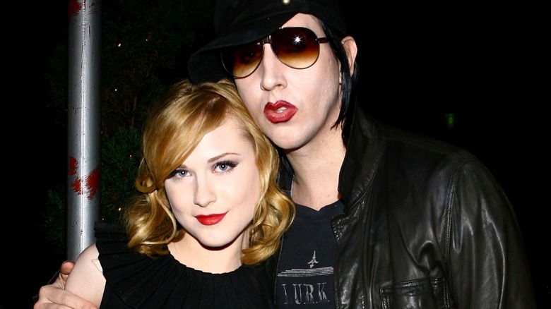 Marilyn Manson and Evan Rachel Wood standing with his arm around her