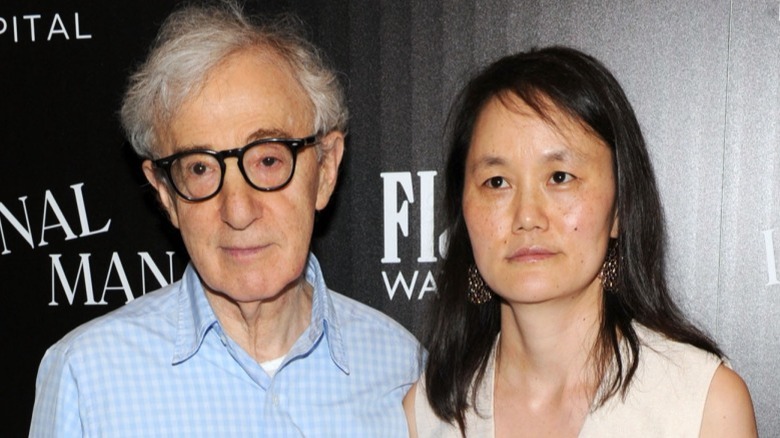 Woody Allen and Soon-Yi Previn against media wall