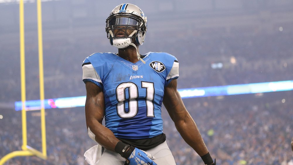 Calvin Johnson striking a pose while celebrating on the field