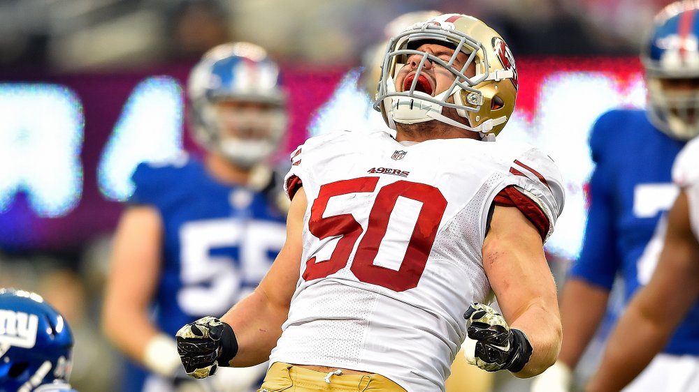 Chris Borland yelling into the air while celebrating on the field