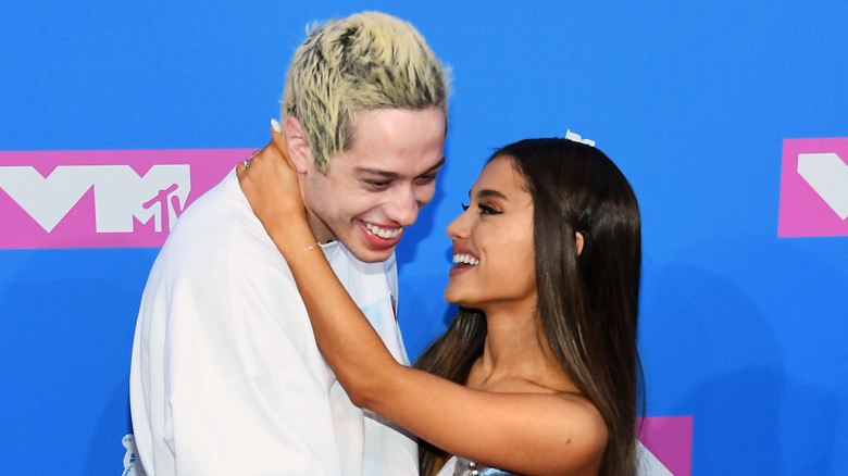 Pete Davidson and Ariana Grande laughing at the MTV VMAs