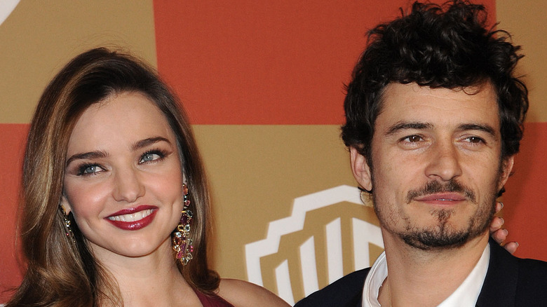 Miranda Kerr and Orlando Bloom posing together