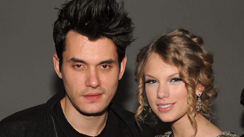 John Mayer and Taylor Swift posing together 