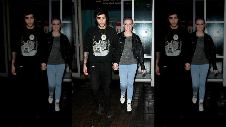 Zayn Malik and Perrie Edwards holding hands